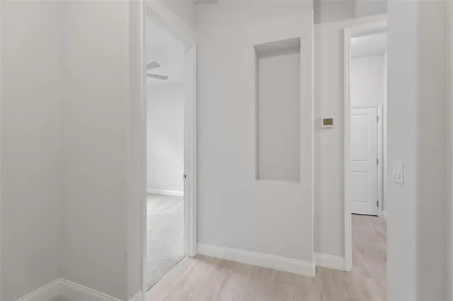 a bathroom with double vanity sinks and a mirror