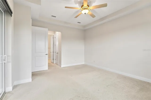 a bathroom with a sink vanity and a toilet