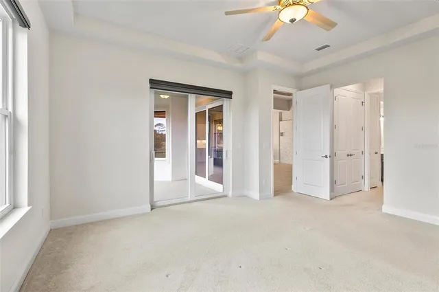 a view of a house with backyard and garden