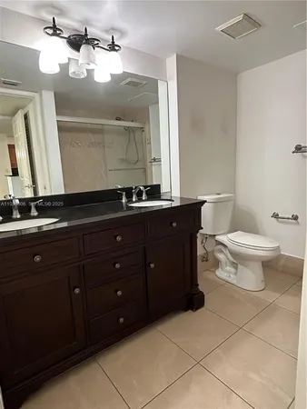 a view of a refrigerator in kitchen and livingroom