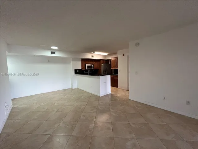 a view of a house with backyard porch and sitting area