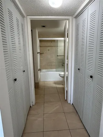 a bathroom with a shower and a sink