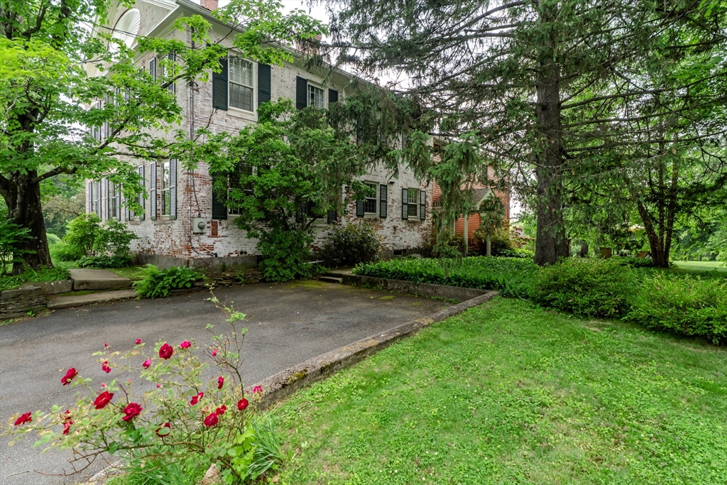 324 Pomeroy Lane Amherst, MA 01002 - Photo 11 of 42 a small garden covered with tall trees
