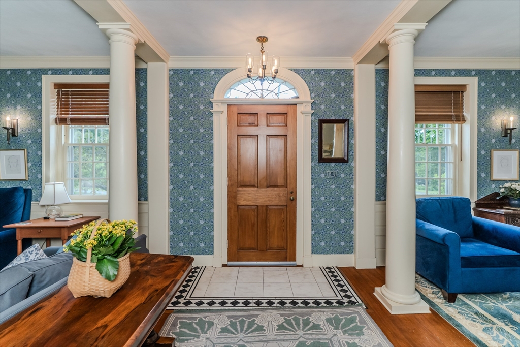 324 Pomeroy Lane Amherst, MA 01002 - Photo 26 of 42 a living room with furniture and a chandelier