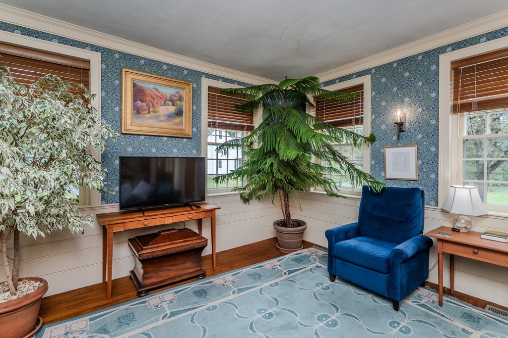 324 Pomeroy Lane Amherst, MA 01002 - Photo 28 of 42 a living room with furniture and a flat screen tv