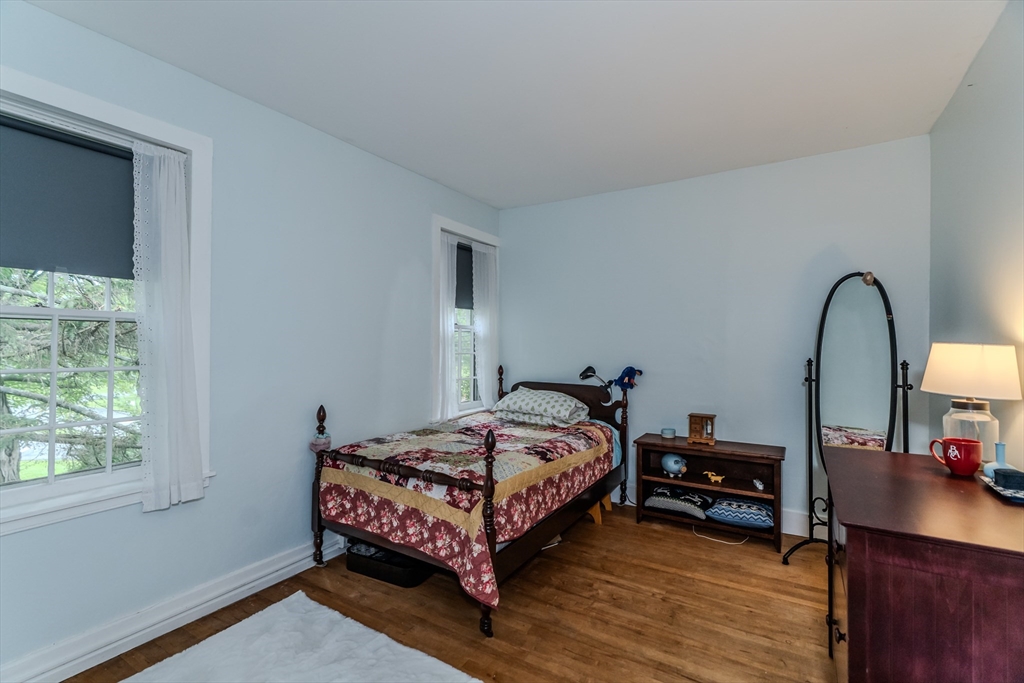 324 Pomeroy Lane Amherst, MA 01002 - Photo 36 of 42 a bedroom with bed and a large window