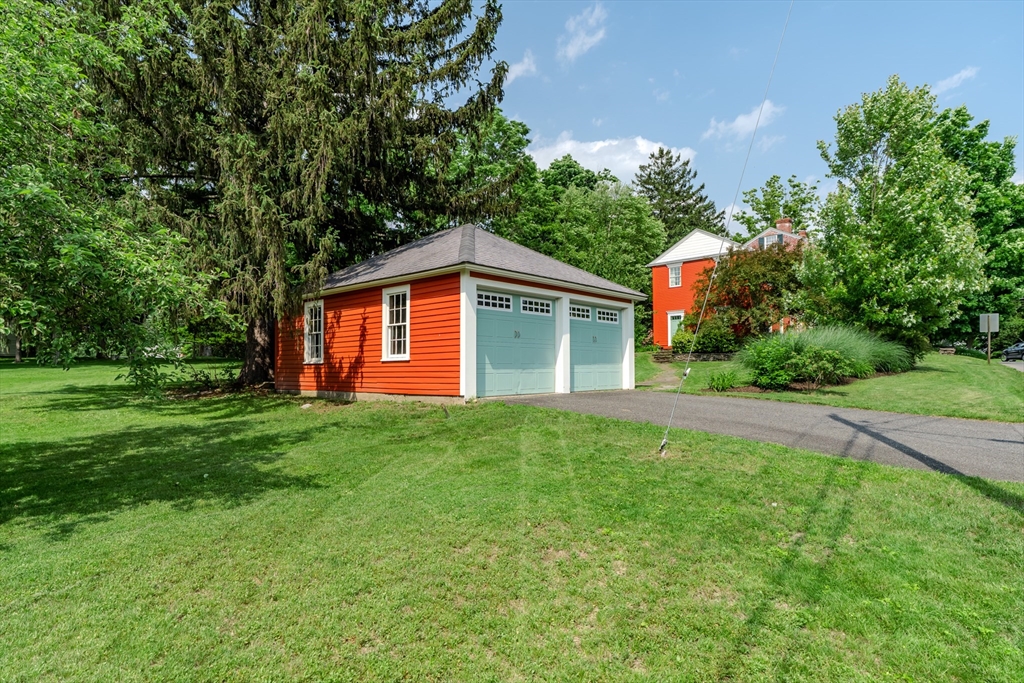 324 Pomeroy Lane Amherst, MA 01002 - Photo 8 of 42 a view of a house with backyard and garden