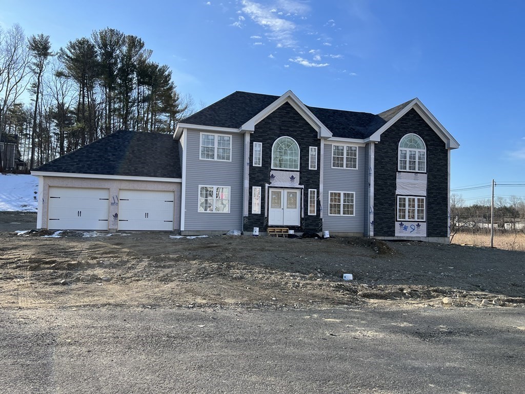 7 Ayer Road Littleton, MA 01460 - Photo 1 of 39 a front view of a house with a yard