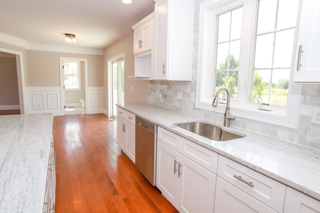 7 Ayer Road Littleton, MA 01460 - Photo 12 of 39 a kitchen with sink and cabinets
