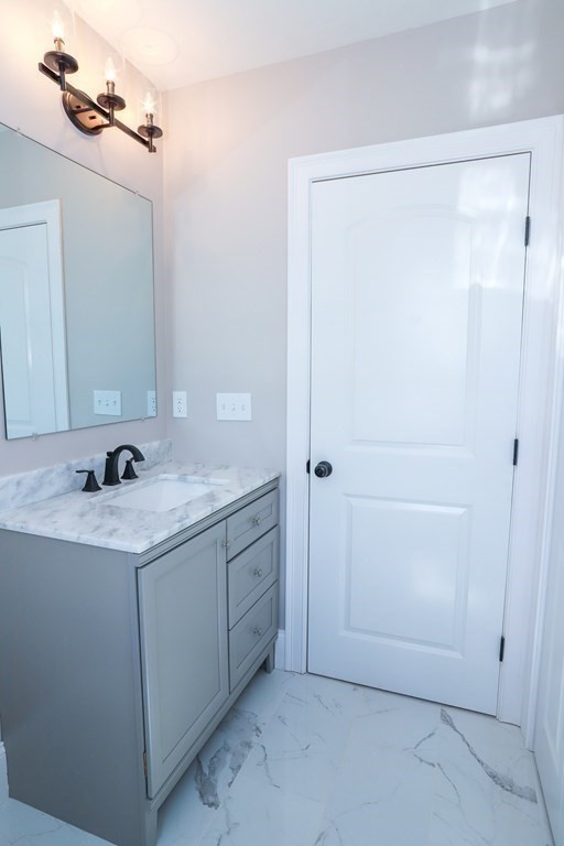 7 Ayer Road Littleton, MA 01460 - Photo 15 of 39 a bathroom with a sink and a mirror