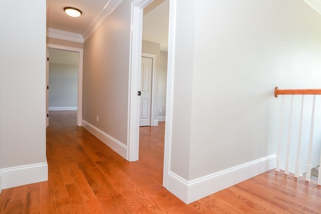 7 Ayer Road Littleton, MA 01460 - Photo 22 of 39 a view of a hallway with wooden floor