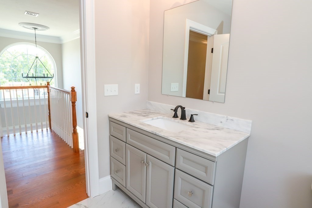 7 Ayer Road Littleton, MA 01460 - Photo 24 of 39 a bathroom with a granite countertop sink and a mirror