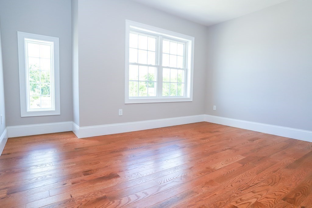7 Ayer Road Littleton, MA 01460 - Photo 30 of 39 an empty room with wooden floor and windows