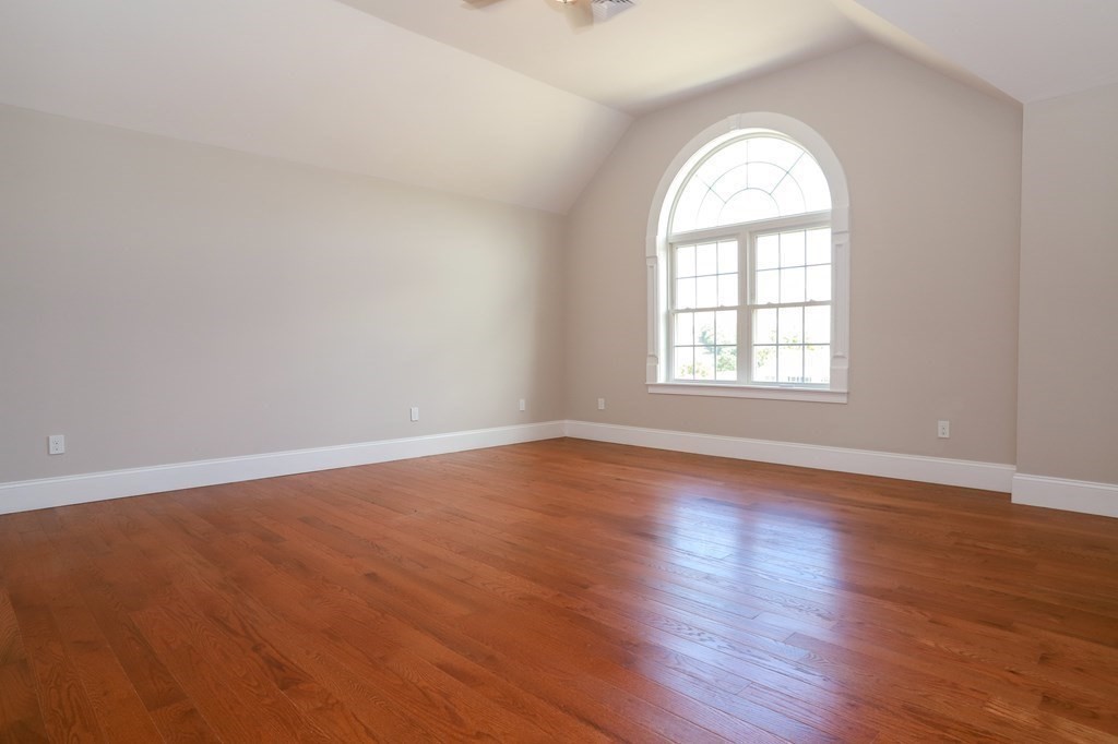 7 Ayer Road Littleton, MA 01460 - Photo 31 of 39 an empty room with wooden floor and windows