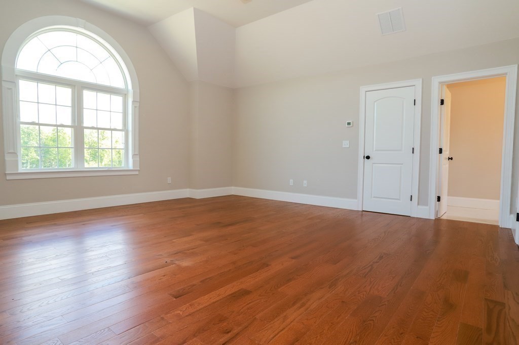 7 Ayer Road Littleton, MA 01460 - Photo 32 of 39 an empty room with wooden floor and windows