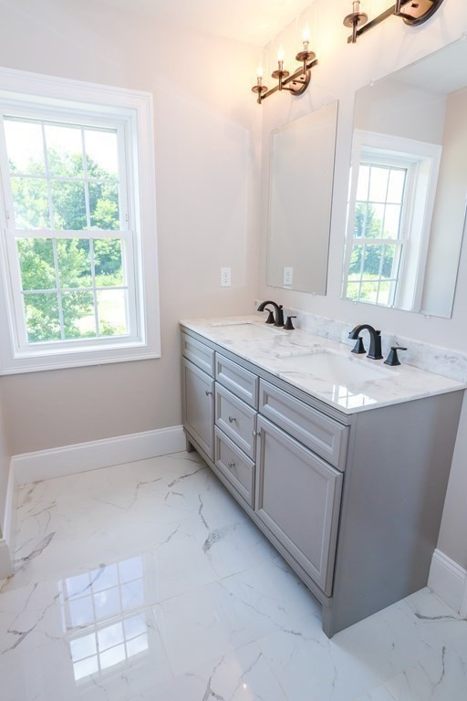 7 Ayer Road Littleton, MA 01460 - Photo 34 of 39 a bathroom with a sink and a mirror