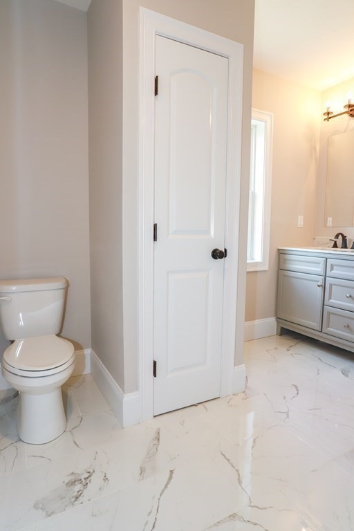 7 Ayer Road Littleton, MA 01460 - Photo 36 of 39 a bathroom with a toilet sink and shower