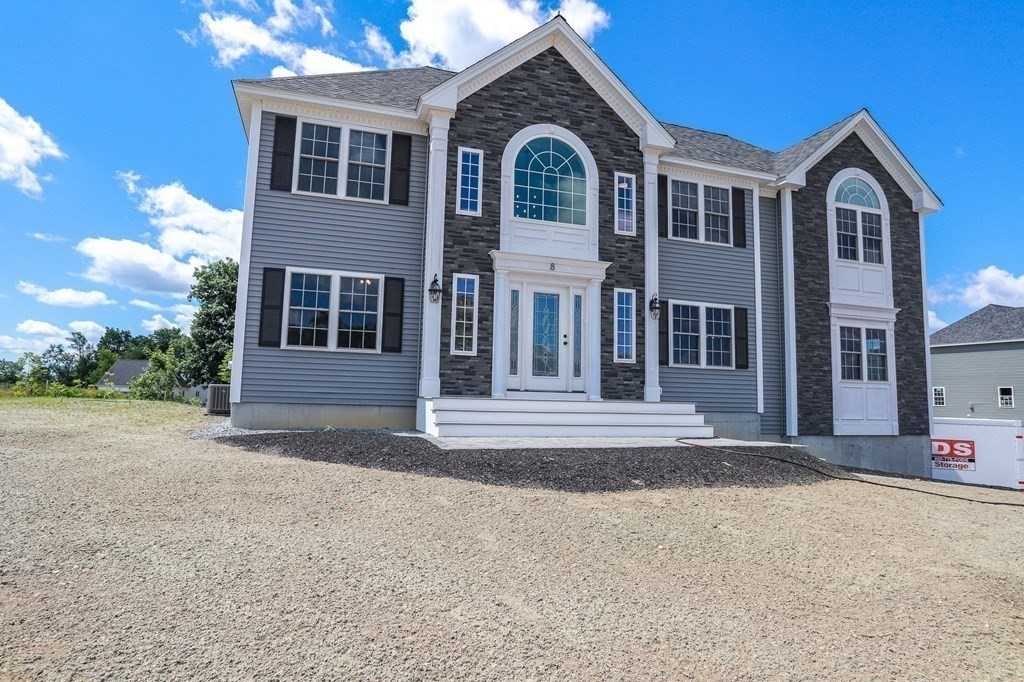 7 Ayer Road Littleton, MA 01460 - Photo 38 of 39 a front view of a house with a yard