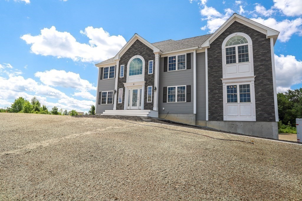 7 Ayer Road Littleton, MA 01460 - Photo 39 of 39 a front view of a house with a garden