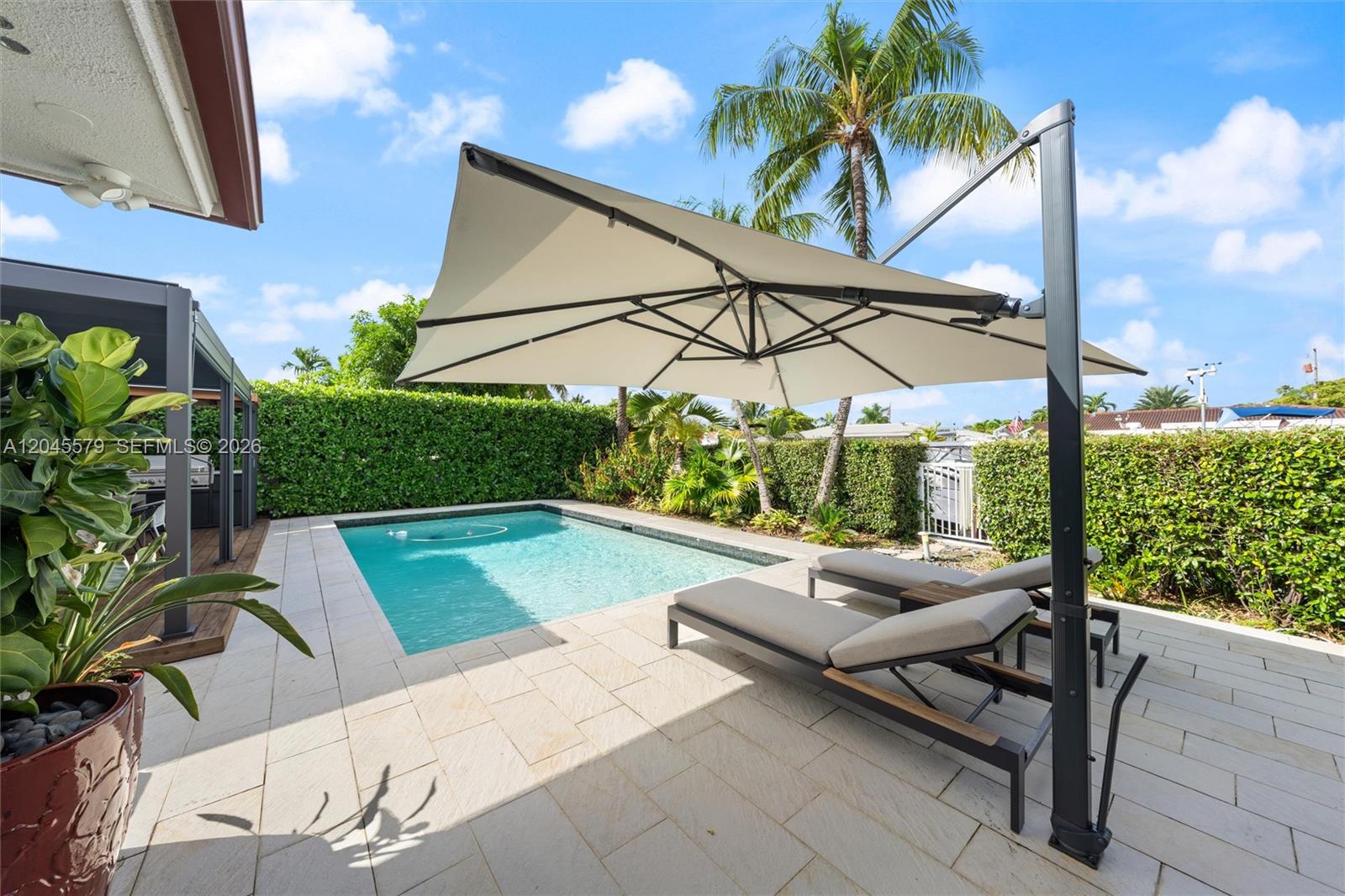 12944 Banyan Road North Miami, FL 33181 - Photo 22 of 26 a view of swimming pool with a patio