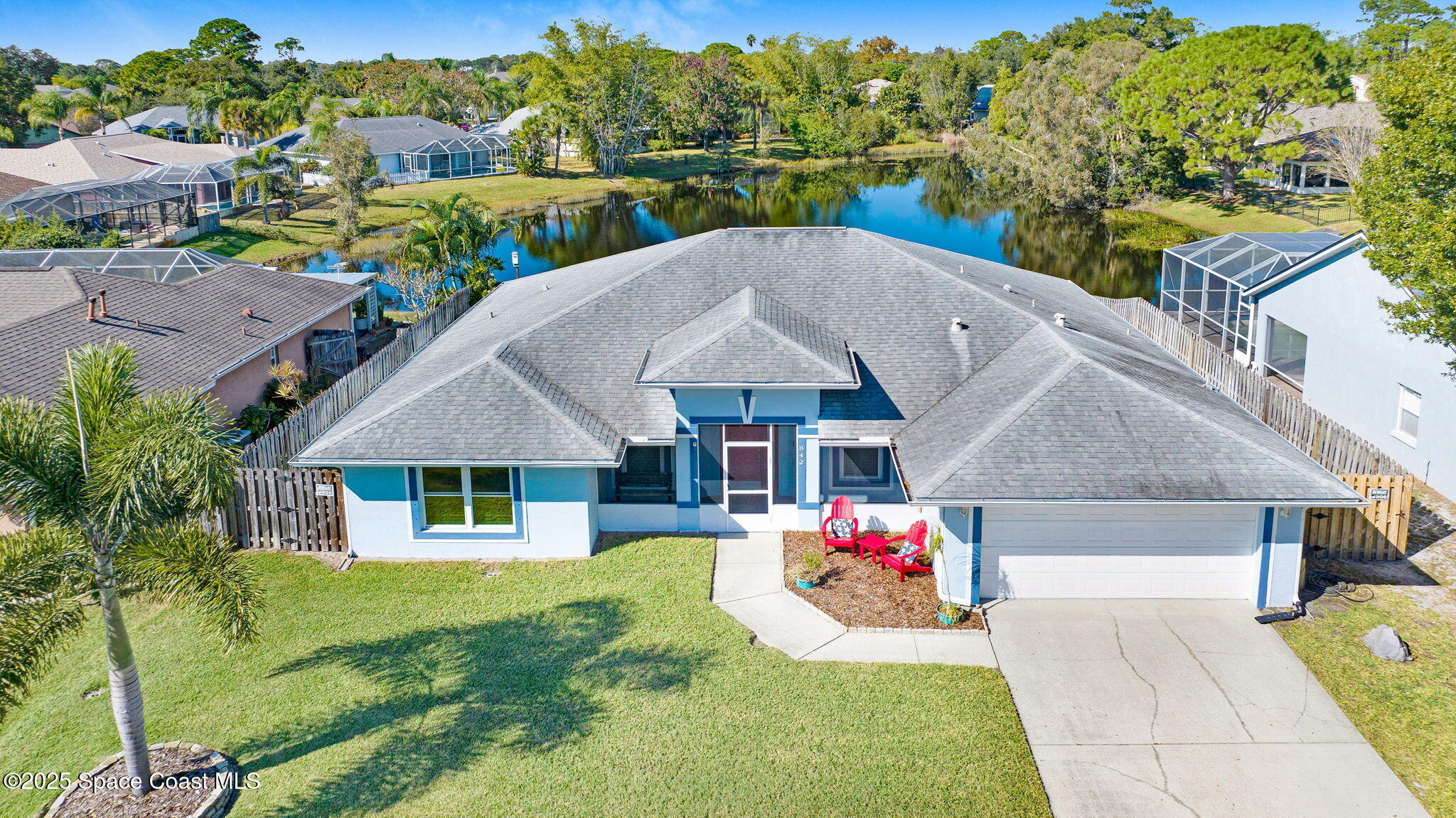 an aerial view of a house with a yard