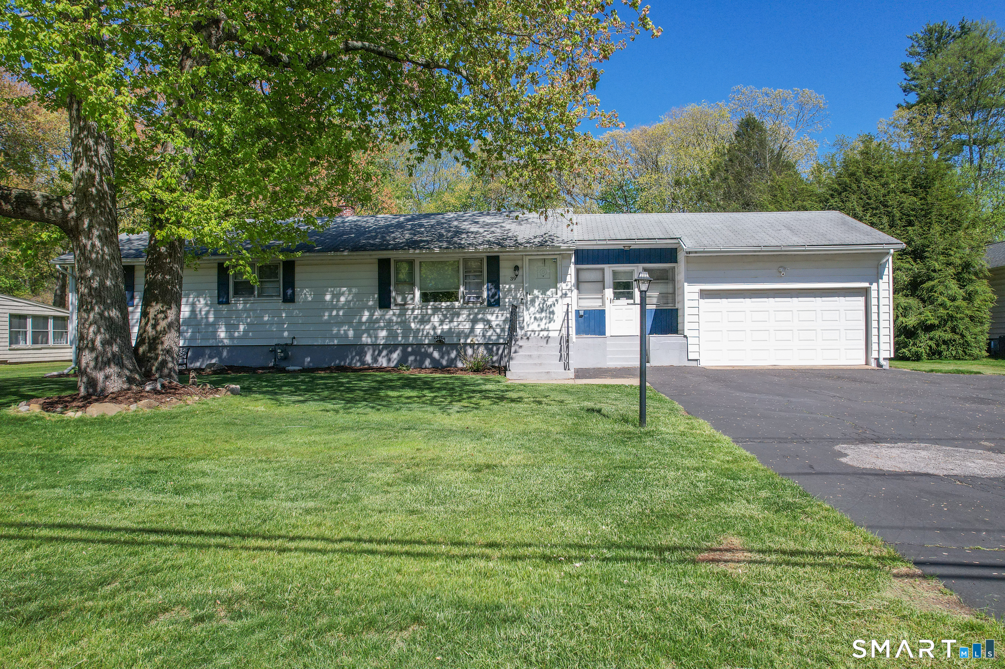 39 Grove Road North Haven, CT 06473 - Photo 1 of 38 a front view of a house with a garden
