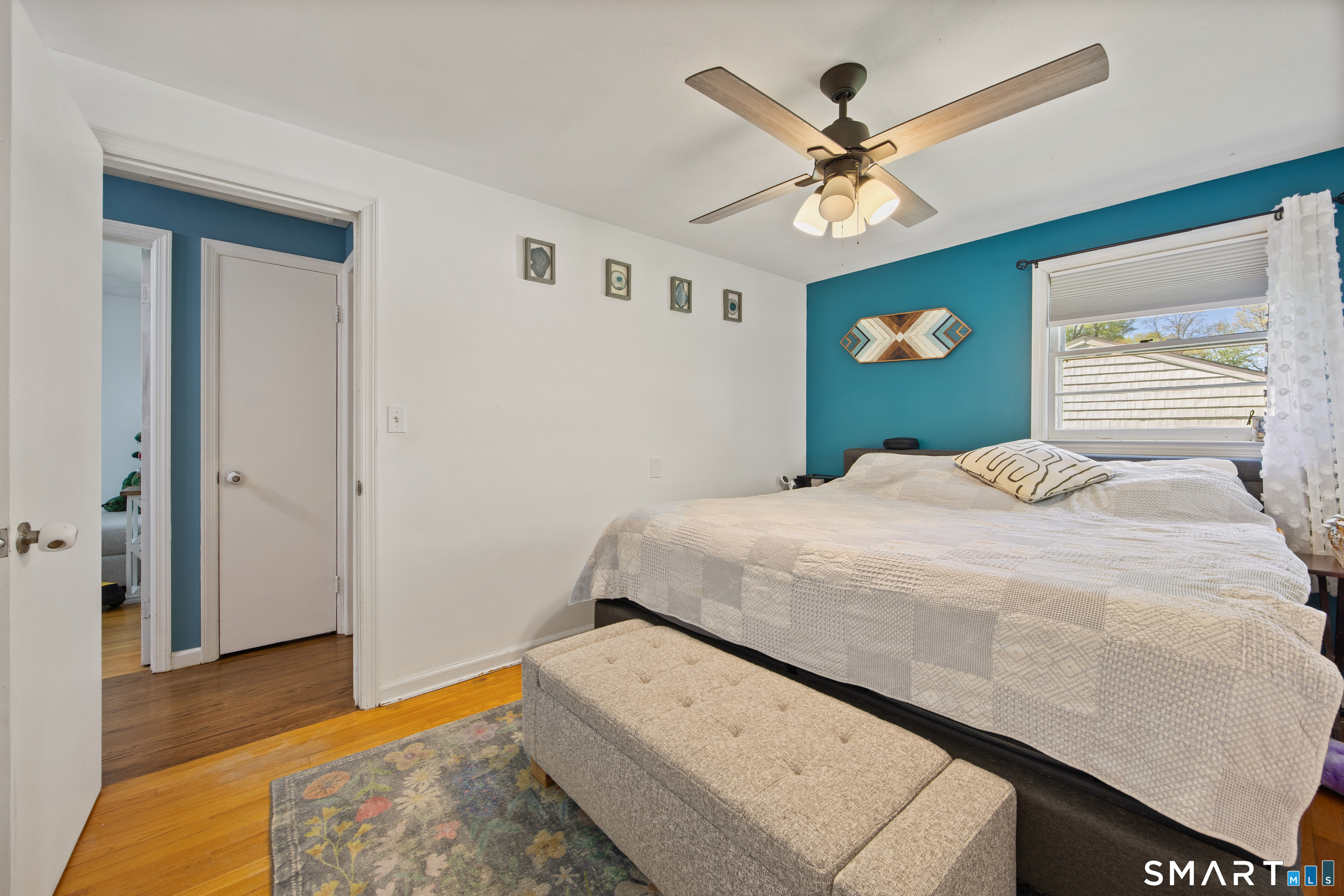 39 Grove Road North Haven, CT 06473 - Photo 23 of 38 a bedroom with a bed and a ceiling fan