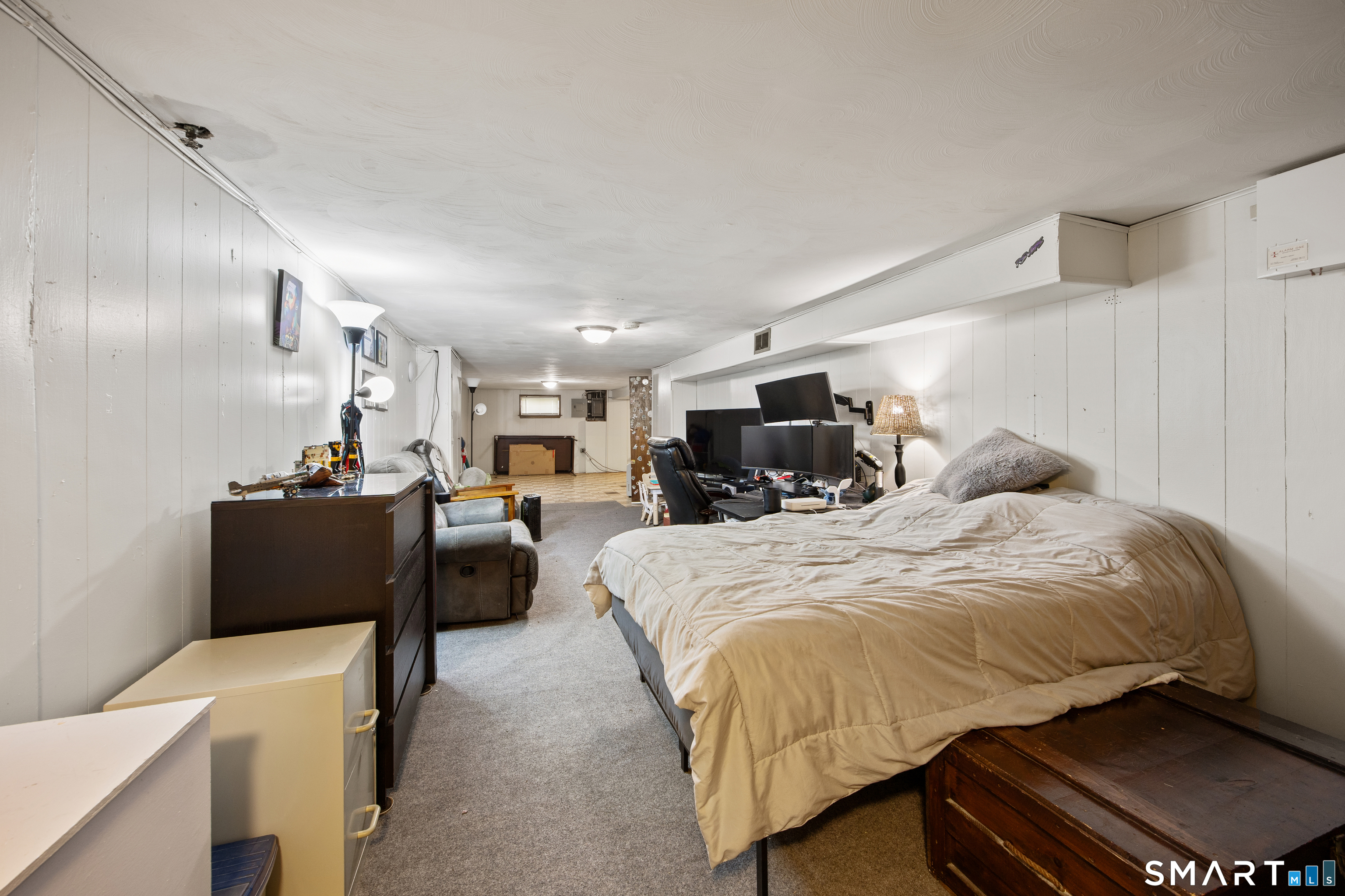 39 Grove Road North Haven, CT 06473 - Photo 31 of 38 a bed room with a bed and a chair
