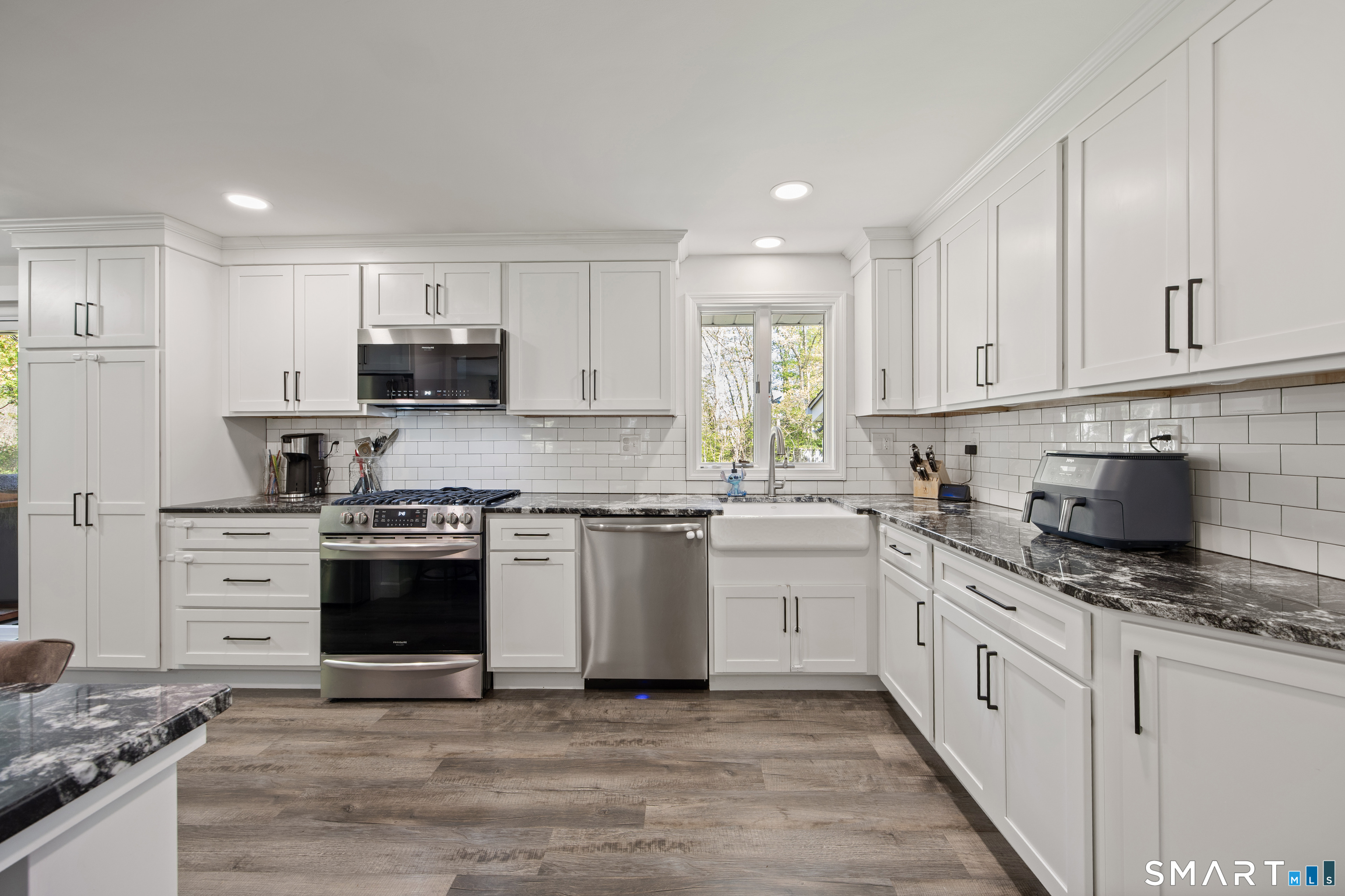 39 Grove Road North Haven, CT 06473 - Photo 5 of 38 a kitchen with stainless steel appliances granite countertop a stove a sink and a refrigerator