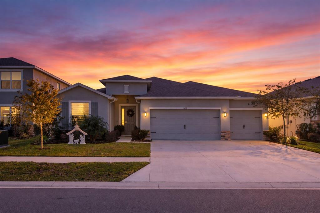 front view of a house with a yard