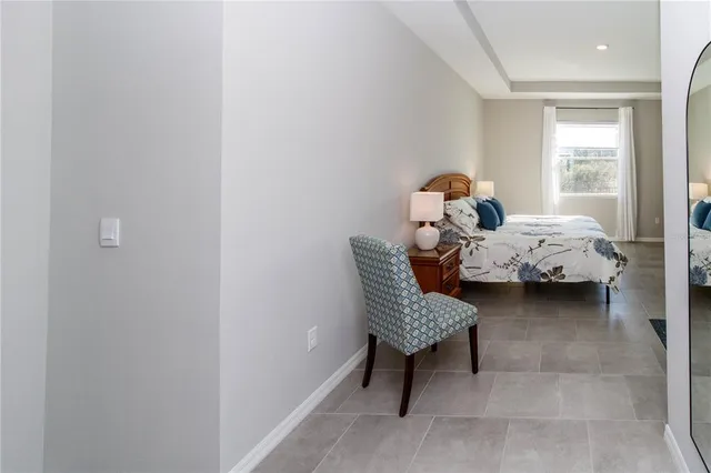 a bed room with furniture and a window