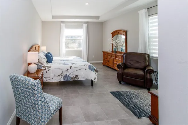 a bedroom with furniture and a window