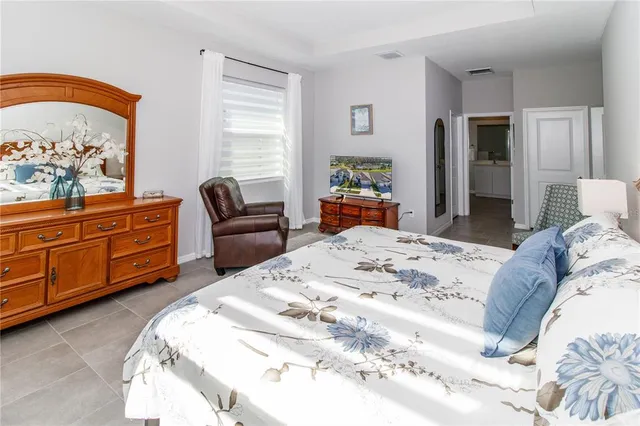 a bed room with a bed and furniture