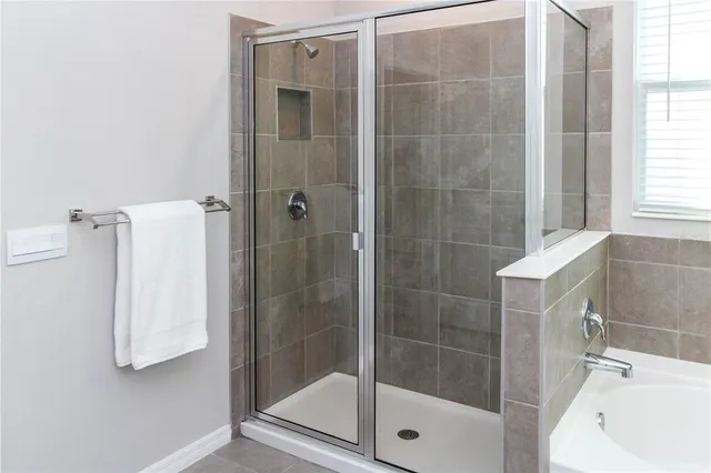a bathroom with a shower and bathtub