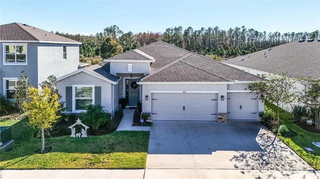 an aerial view of houses with a swimming pool