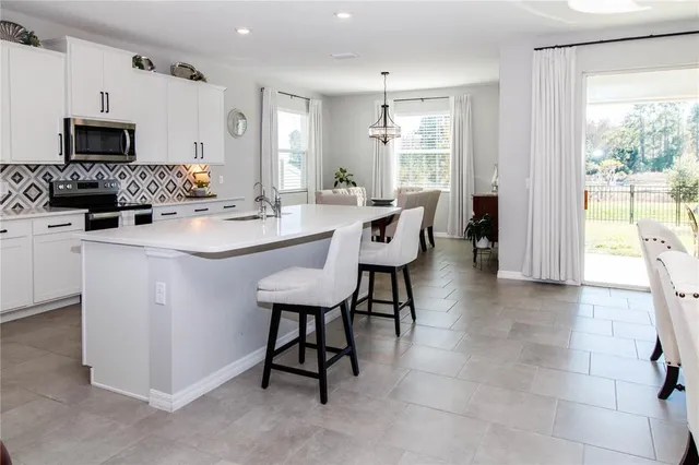 a view of kitchen with breakfast area