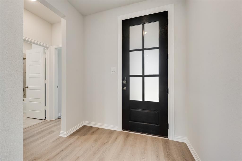 4136 Tarlton Road Little Elm, TX 75068 - Photo 15 of 28 an empty room with windows and closet