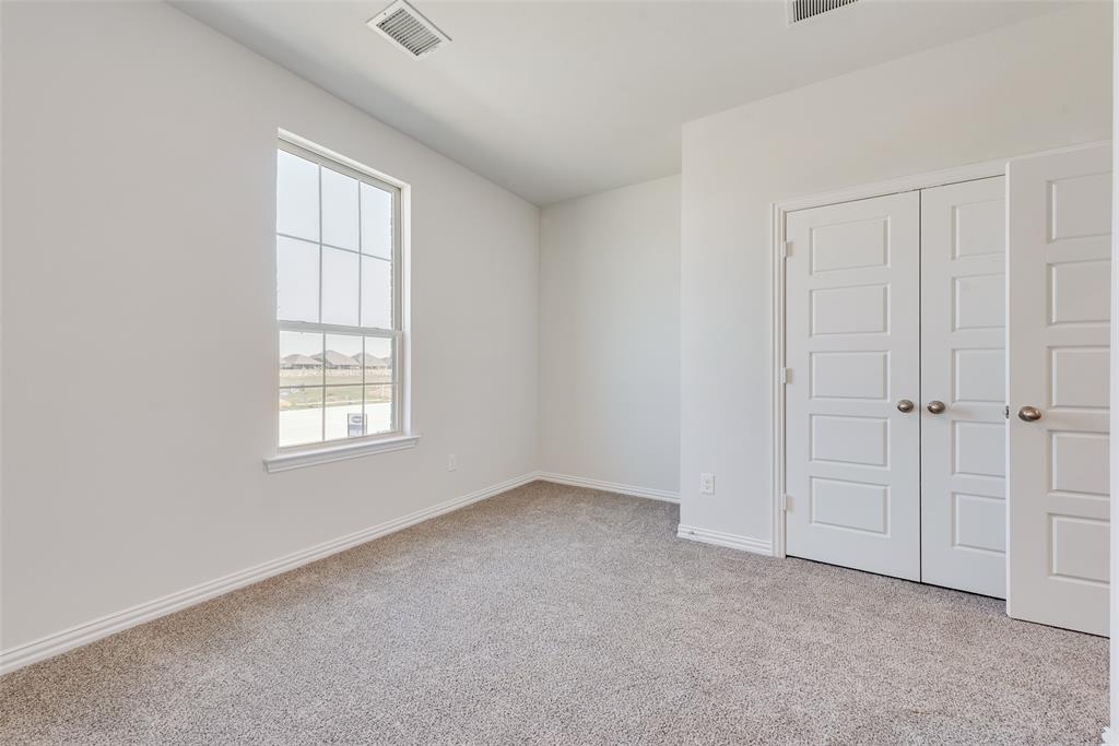 4136 Tarlton Road Little Elm, TX 75068 - Photo 23 of 28 an empty room with windows