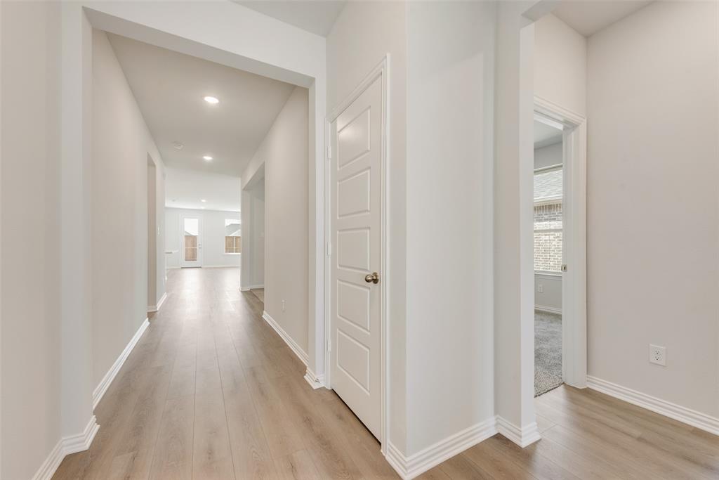 4136 Tarlton Road Little Elm, TX 75068 - Photo 6 of 28 a view of a hallway with wooden floor