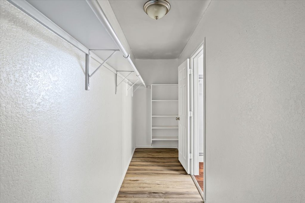 17912 Aleppo Pine Elgin, TX 78621 - Photo 17 of 30 Spacious closet featuring light wood-type flooring
