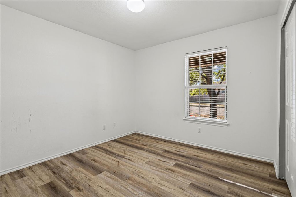 17912 Aleppo Pine Elgin, TX 78621 - Photo 18 of 30 Unfurnished room with wood finished floors