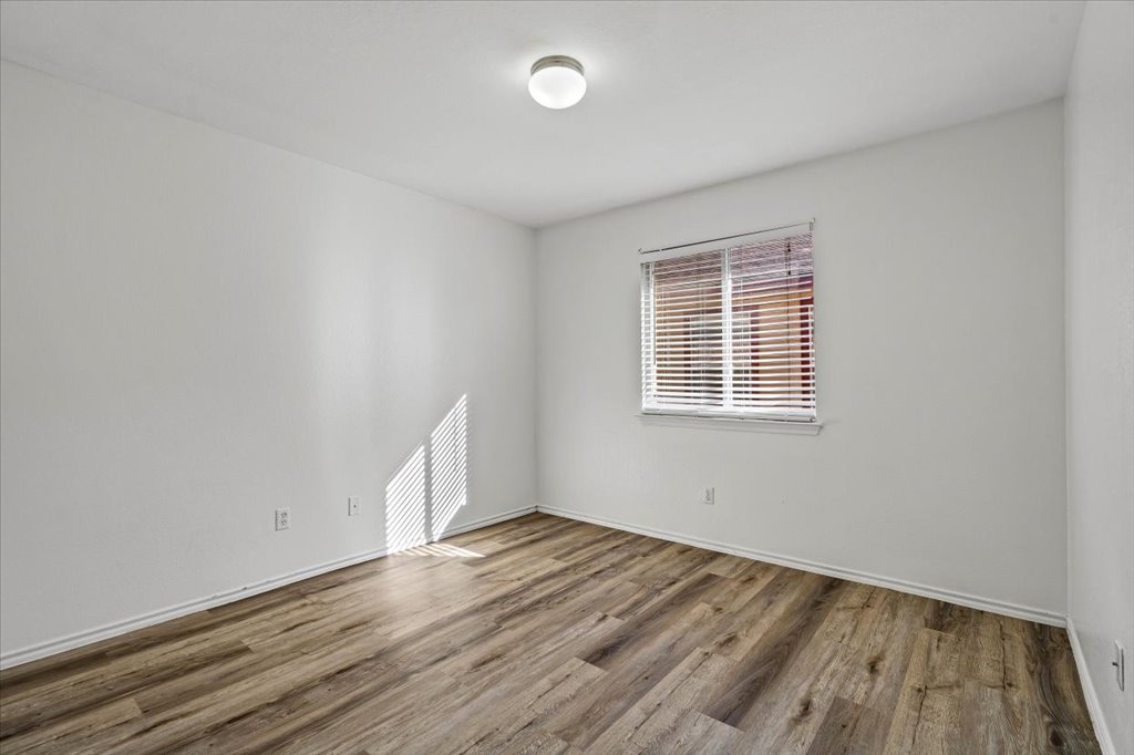 17912 Aleppo Pine Elgin, TX 78621 - Photo 21 of 30 Spare room with wood finished floors and baseboards