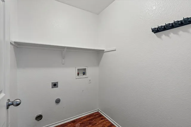 a bathroom with a sink a toilet and shower curtain
