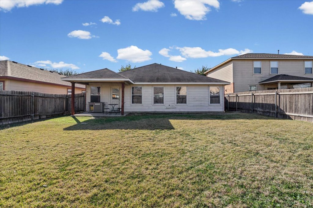 17912 Aleppo Pine Elgin, TX 78621 - Photo 25 of 30 Rear view of house featuring a patio and a fenced backyard