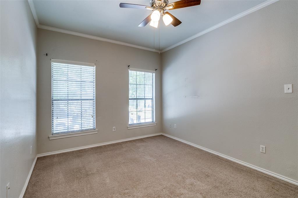 6003 Oram Street, Unit 104 Dallas, TX 75206 - Photo 12 of 23 a view of an empty room with a window