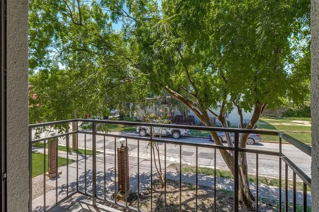 a view of trees from a balcony