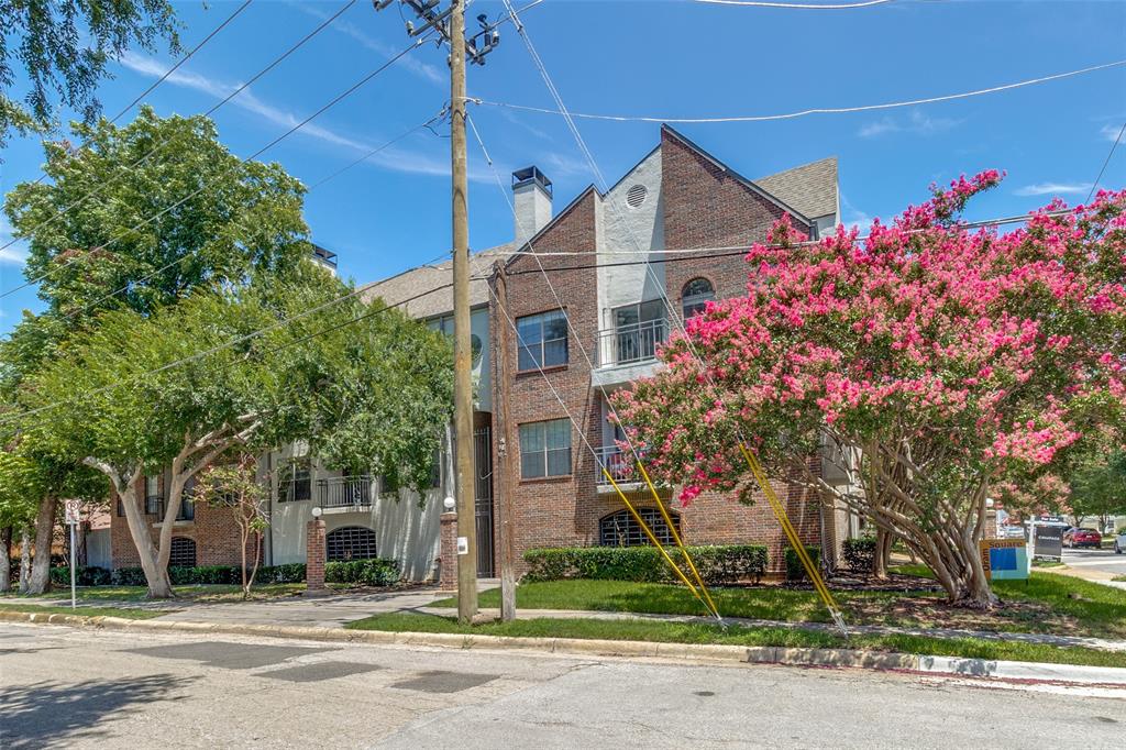 6003 Oram Street, Unit 104 Dallas, TX 75206 - Photo 18 of 23 a front view of a house with a yard