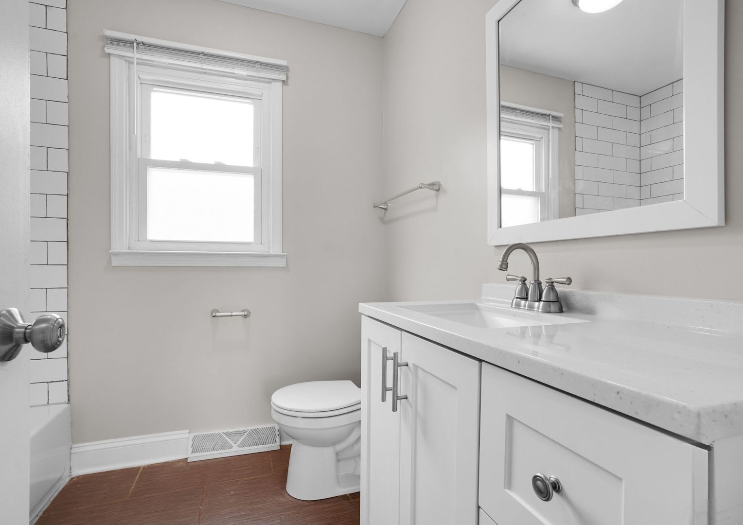 294 Madison Avenue Calumet City, IL 60409 - Photo 11 of 19 a bathroom with a granite countertop sink toilet and mirror