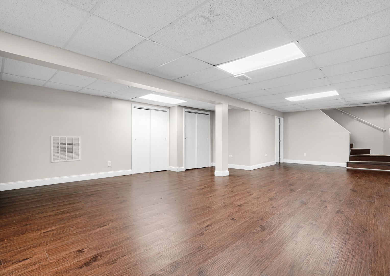 294 Madison Avenue Calumet City, IL 60409 - Photo 14 of 19 a view of an empty room with wooden floor and a window