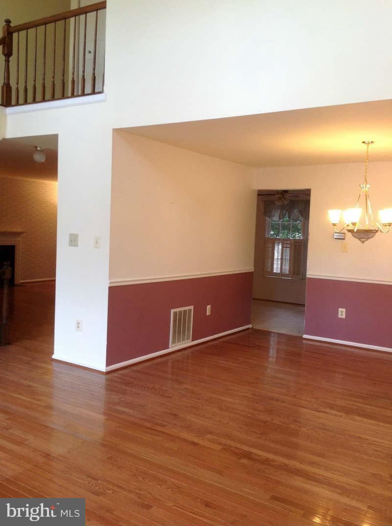 11624 Bootjack Court North Potomac, MD 20878 - Photo 3 of 15 a view of an empty room with wooden floor and a window
